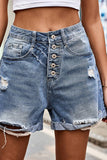 A pair of denim shorts with a hole in them_CWBSP0247